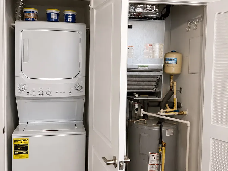 Washer/dryer and in-unit hot water heater and AC vent. Unit has dedicated central AC and heating.