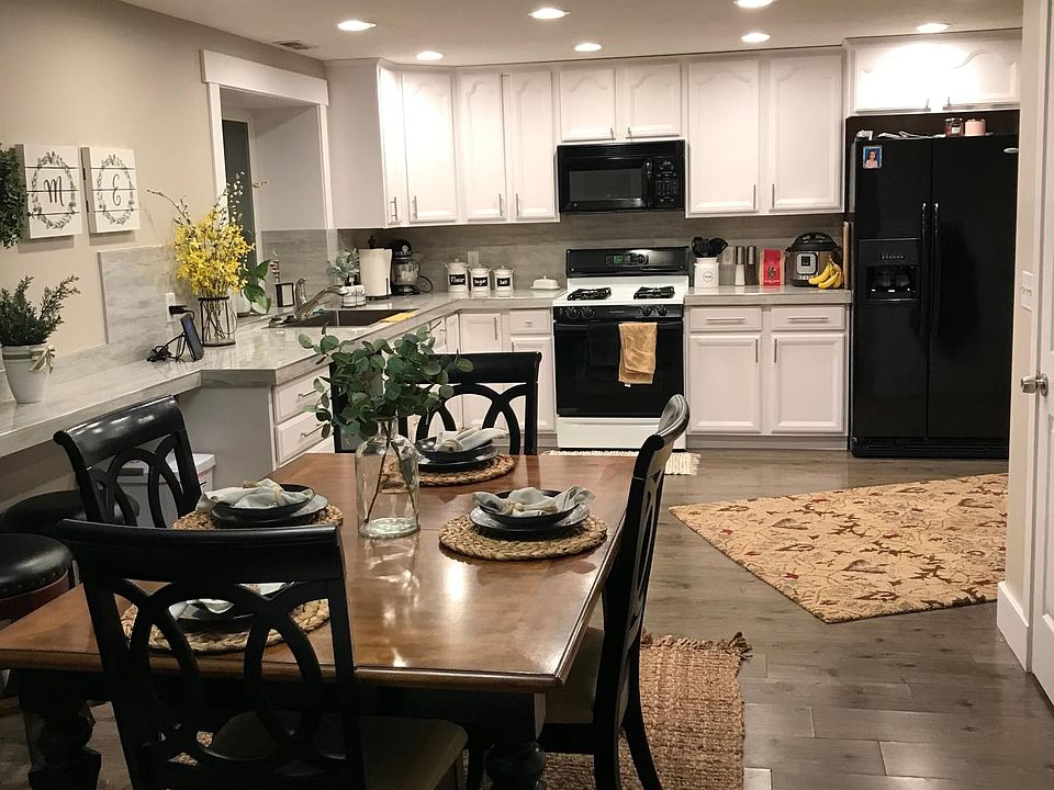 Kitchen with appliances, including microwave