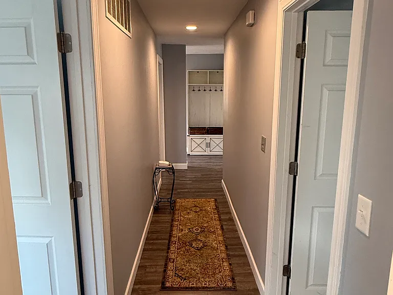 Hallway to two private bedrooms
