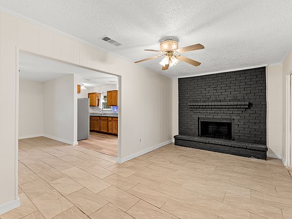 Family room with fire place and the Living room adjacent to each other.