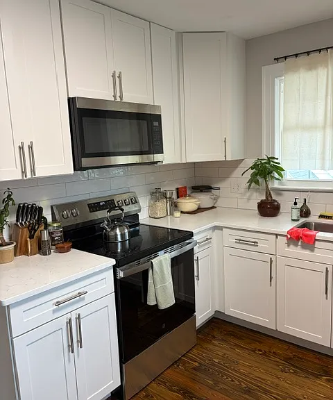 Kitchen from a recent remodel in the same building. Will have the same cabinets and quartz counters and new appliance package