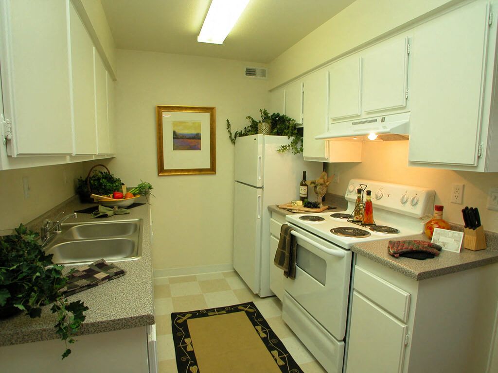 Kitchens include dishwasher and refrigerator
