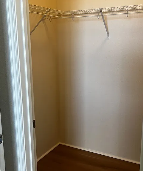 Walk in closet in primary bedroom