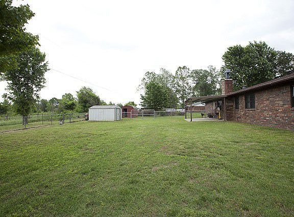 Immense backyard overlooks greenbelt.