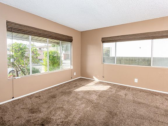 TV room with plenty of light when the blinds are open.