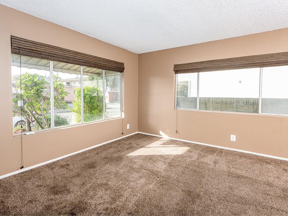 TV room with plenty of light when the blinds are open.