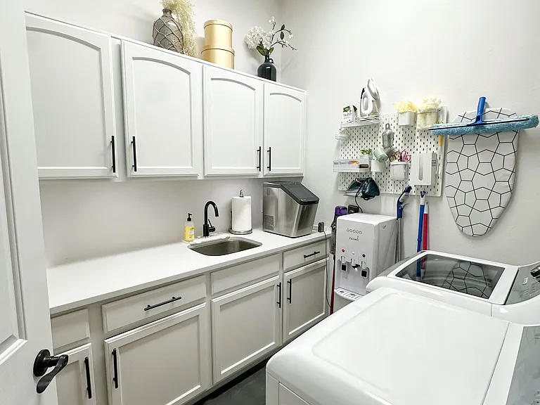 Laundry room with plenty of storage.