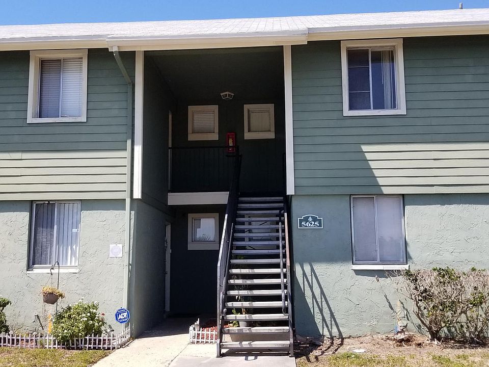 Front of building, unit upstairs on left 