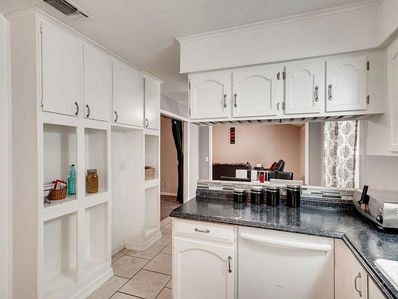 Updated Kitchen. View through the bar to the living room.