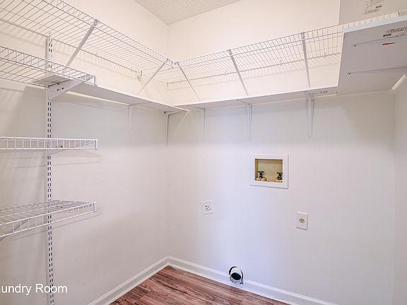 Laundry hookups available with pantry shelving