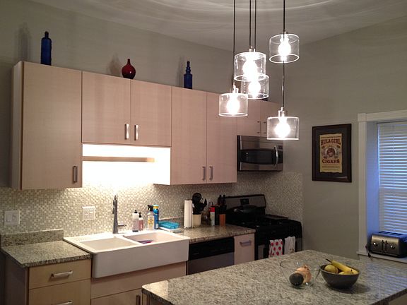 Pendant lighting, 1.25" granite counters, farmhouse sink, gl