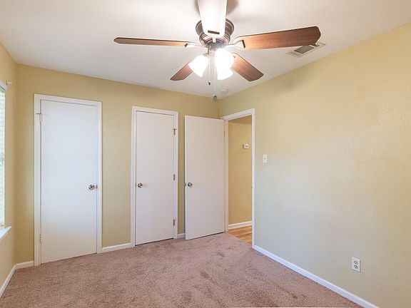 front bedroom. two closet doors to connecting closet, faces front of property