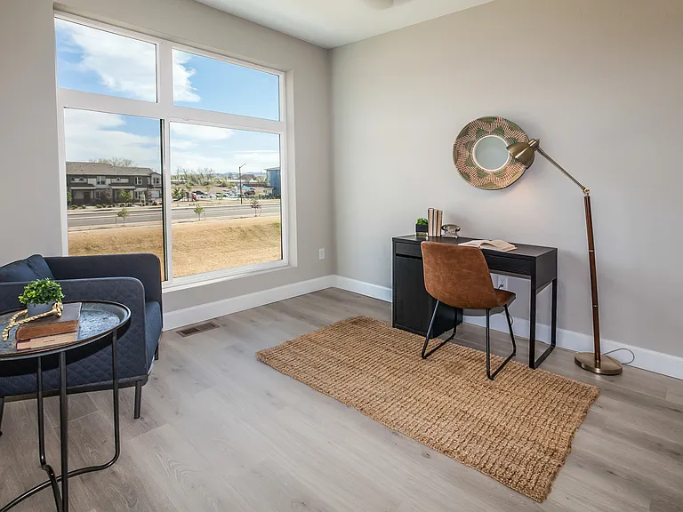 Main-level flex room with door (no closet). Can be used as a playroom, office area, or guest room.