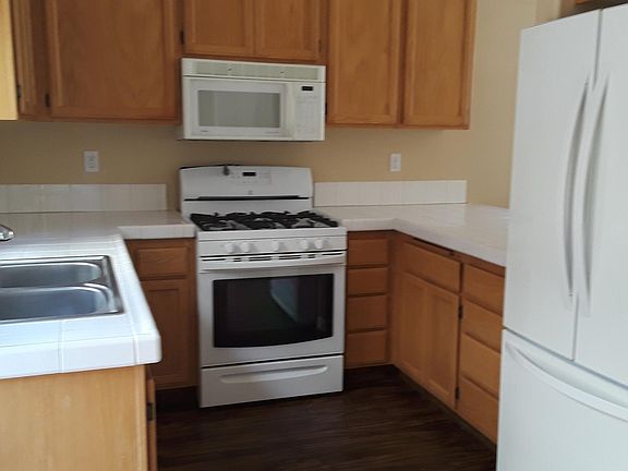 Kitchen overlooks private backyard