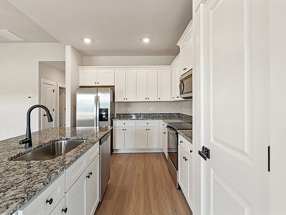 The kitchen has granite countertops