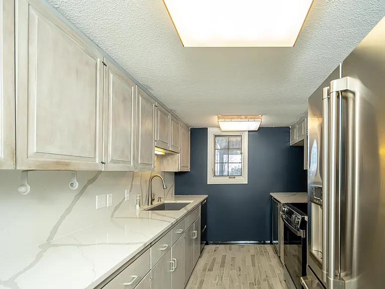 Galley Kitchen with very nice appliances.