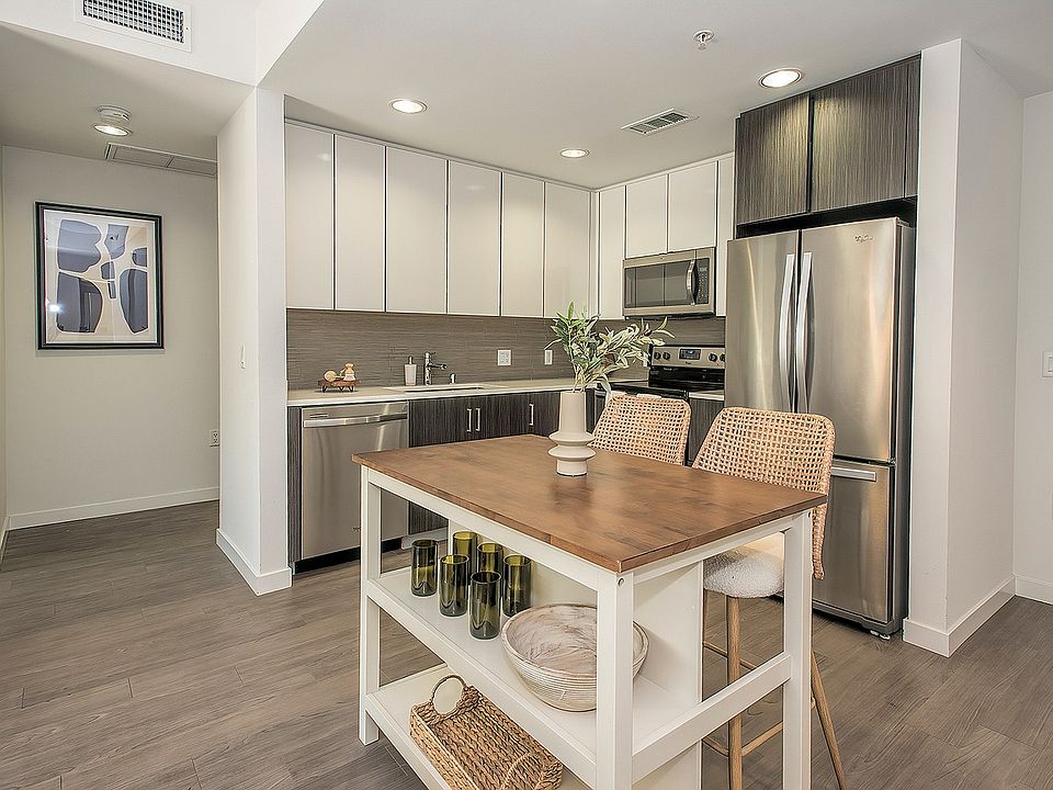 Modern kitchen featuring stainless-steel appliances, sleek cabinetry, and ample counter space.