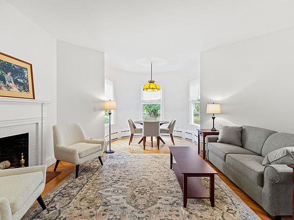 Living room with wood burning fireplace