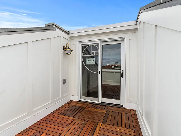 Private Penthouse walk out deck with Golden Mean Spiral door trim. 270 degree panoramic city and bridge views