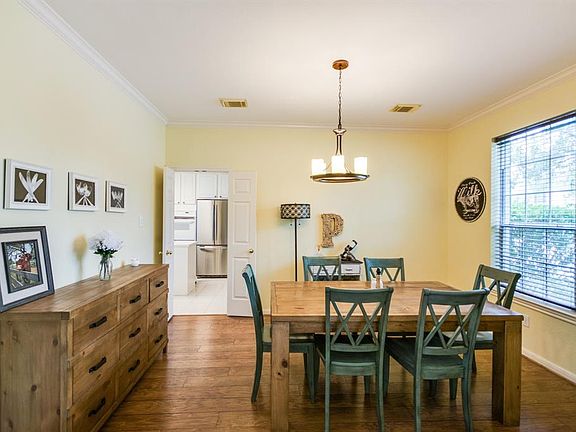 Spacious formal dining room with french doors to kitchen.