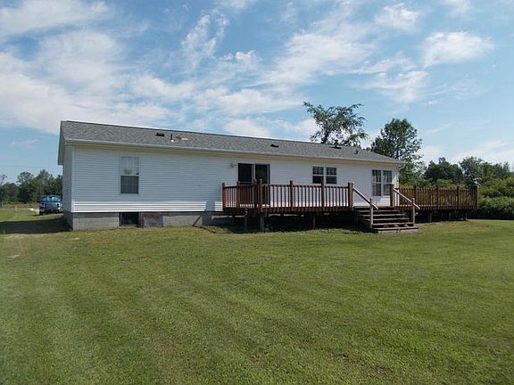back view of the home and the large wrap around deck.