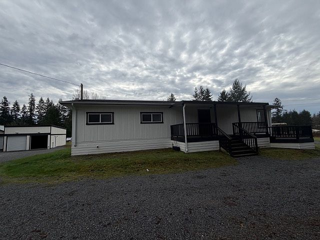 Mobile Home with detached car garage.
