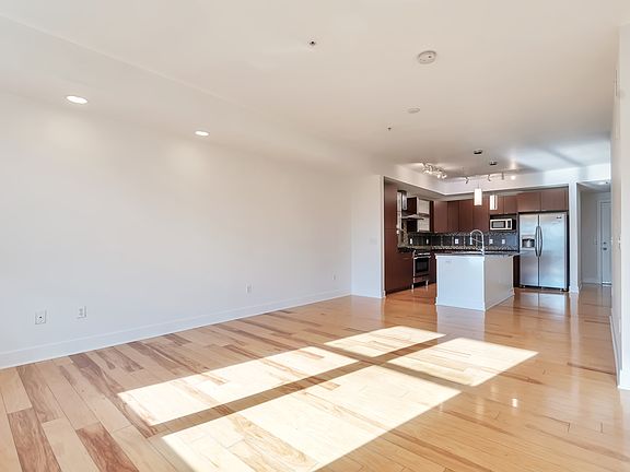 open floorplan with spacious great room leading out to balcony