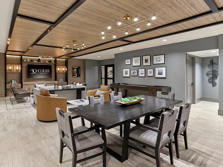 Experience luxury and comfort in this sleek, modern clubhouse designed for relaxation and dining.