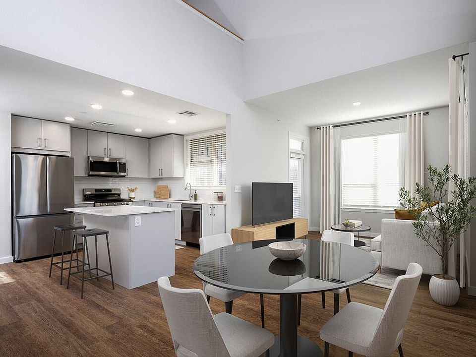 Kitchen, dining, and living room with hard surface flooring