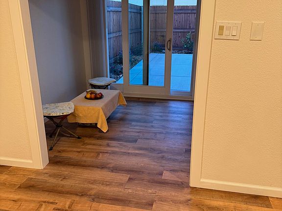 Living room, dining area, back patio