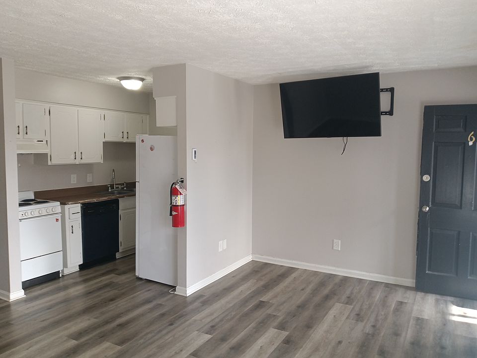 Unfurnished Living room/ Kitchen view. All apartments have TVs and Free WiFi