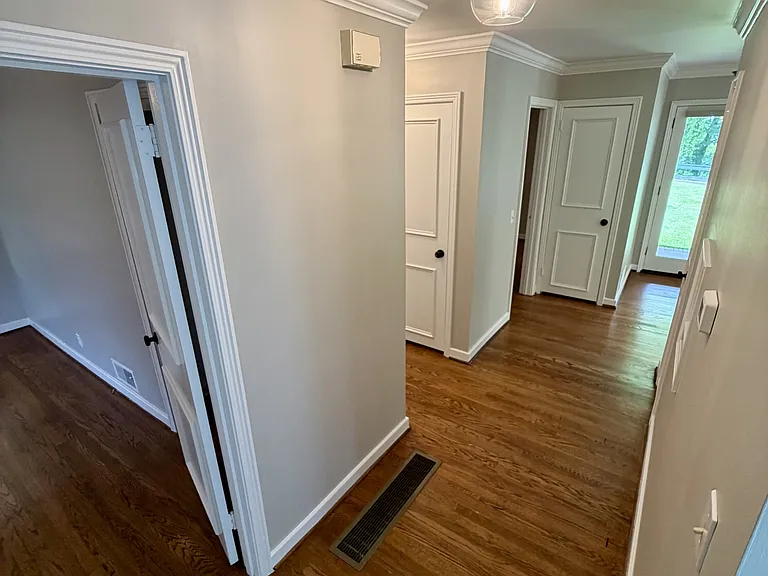 Hallway connected to bedrooms & bathrooms
