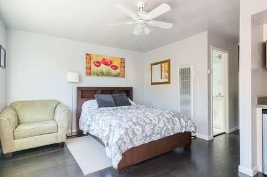 Comfy chair and queen size bed.
