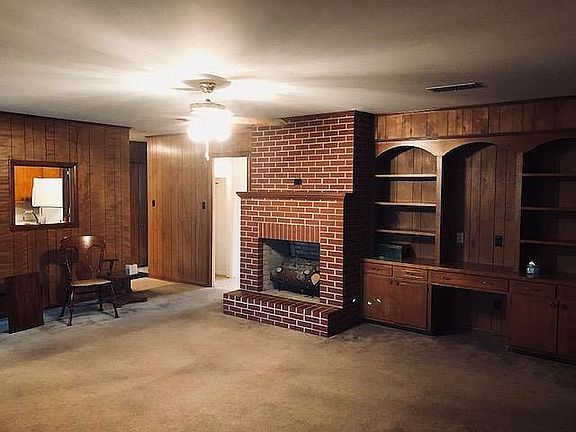 Den fireplace-bookcase desk.