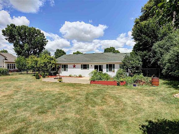 TREE LINED AND FENCED-IN BACKYARD