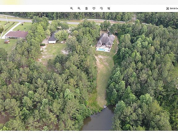 Drone view of home and lake