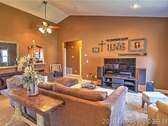 The large living area greets you upon entering, with direct access to the kitchen and bedrooms.