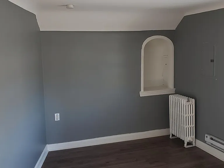 Living room with storage alcove.