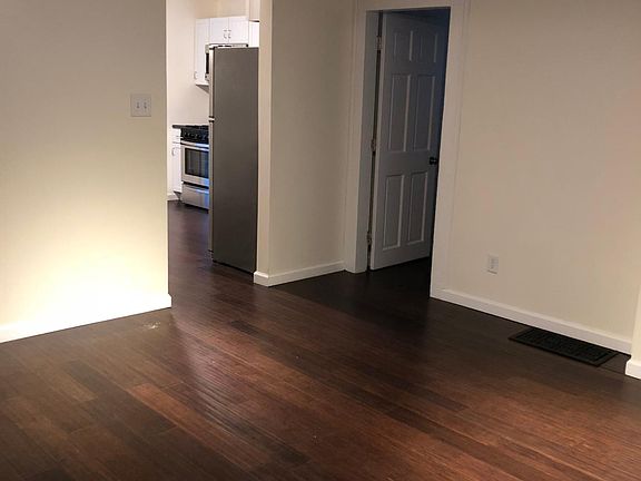 Front room/living room with new lighting and fan.