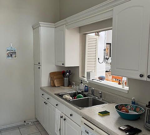 Kitchen with window opening into Living Room