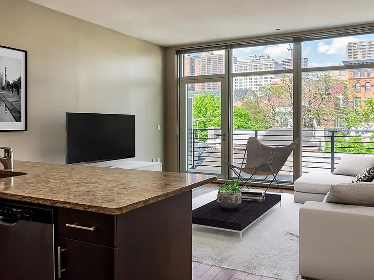 Floor to ceiling windows in each home and wood flooring throughout