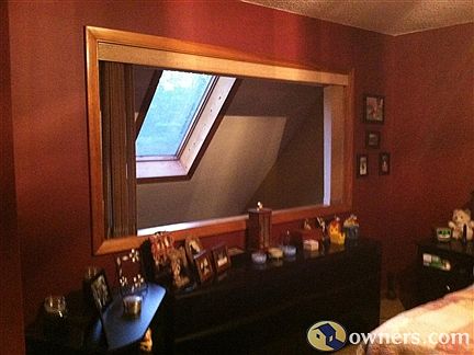 Master bedroom overlooking first floor with skylight