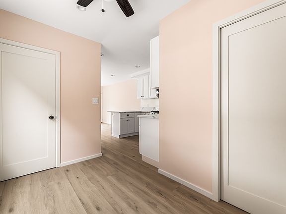 Door on the left is for a storage closet and the right side is the downstairs bathroom