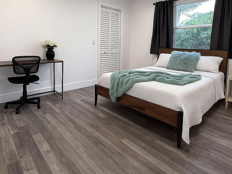 Large room with queen size bed with matress cover.