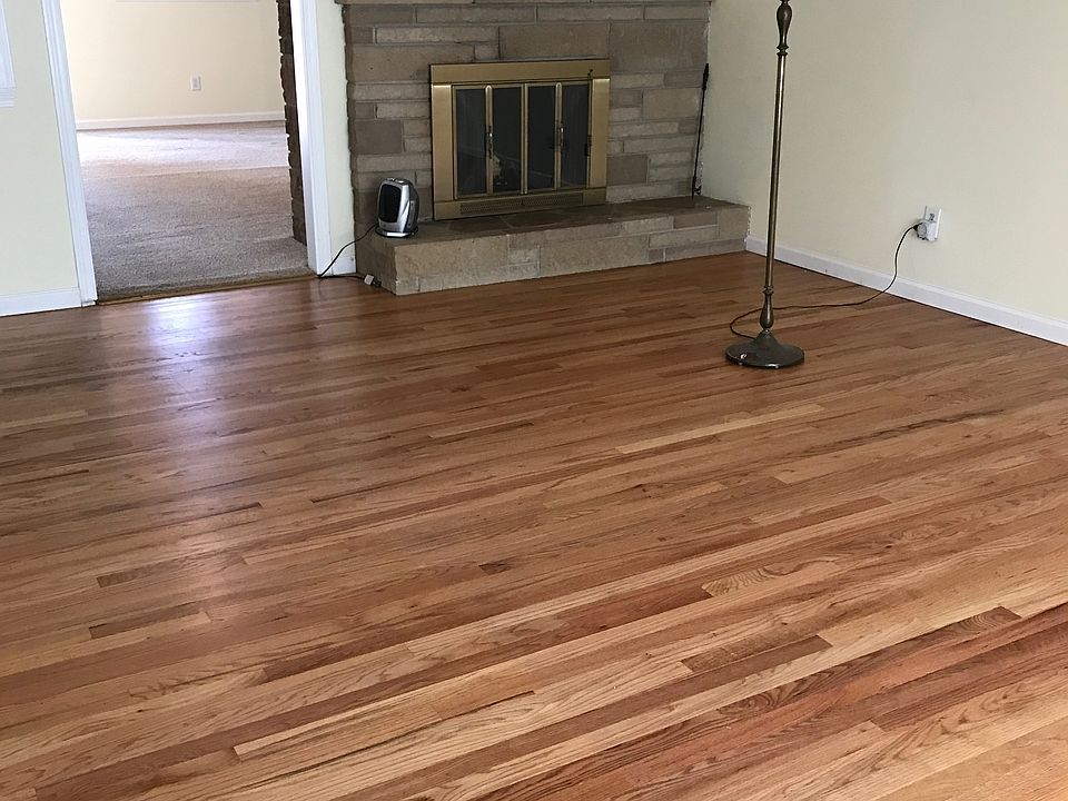 formal living room with wood burning fireplace