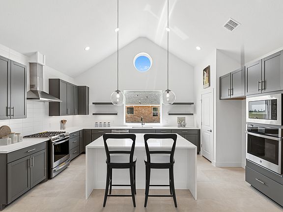 Kitchen with soaring vaulted ceiling