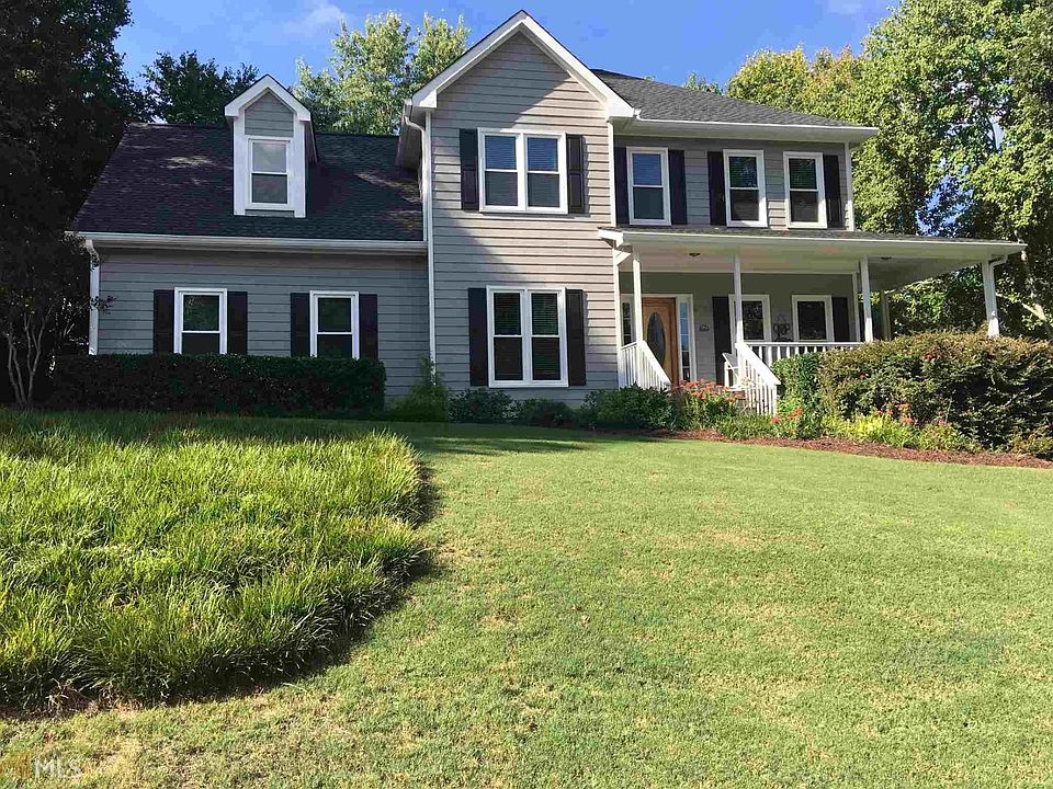 Well maintained and updated traditional 2-story home sits on corner lot - side entry garage -