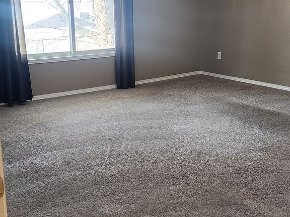 Huge living room with open concept to kitchen. Newer Carpet