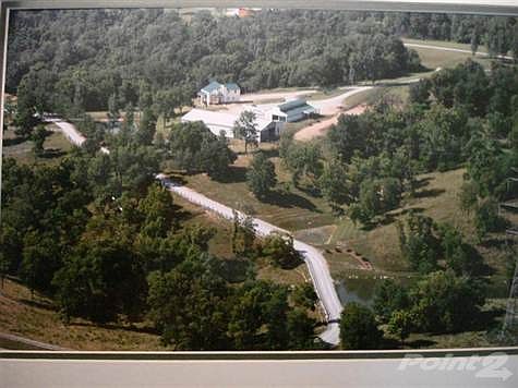 House Size was Doubled-2006. Seven Very Large Picture Window as Large 6'x6' Overlooking Awesome Ohio River- Also Palladium Windows etc. Full Poured Concrete Foundation.  Vinyl Maintenance Free Siding. 4BR 2.5 Baths. All Outside Walls are 2x6'S with Insulation. Barn has been increased from 35' Long to 70'x36' with 5 Stalls. The Riding Arena is Lighted for NIGHT TIME Use, it is  120'x 60'.