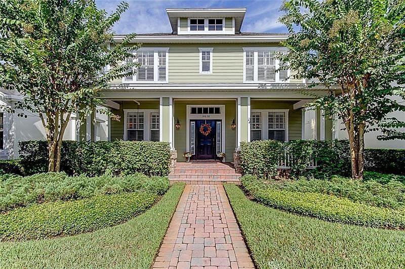 Front Exterior Full Porch with Brick Updated Entrance & Steps